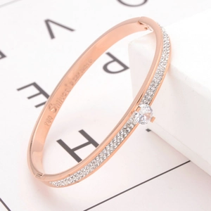 Rose gold titanium steel bracelet featuring double-row crystals and a round center stone