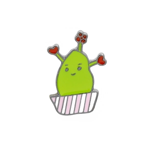 Detailed close-up of a green cactus enamel pin with red hearts in a striped flower pot