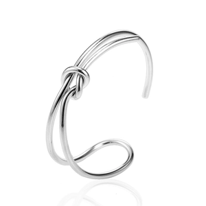 Polished silver knot open bangle featuring minimalist double line stainless steel design