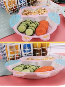 Close-up of pink owl-shaped bamboo fiber divided plate for kids with food segments