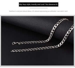 Detailed close-up of a silver Cuban link chain featuring a durable lobster clasp
