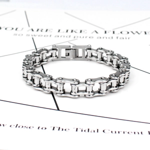Detail shot of silver titanium steel motorcycle chain bracelet with metallic luster