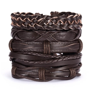 Detail of vintage braided leather bracelets showing hand-woven textures and dark brown layers