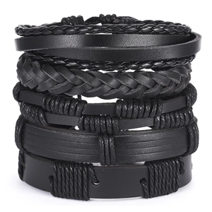 Men's stackable black leather braided bracelets with various textures and layered design