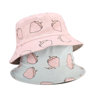 Pink and light blue reversible fisherman bucket hats with strawberry prints on canvas