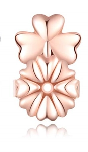 Macro detail of rose gold heart-shaped earring lifters on a clean white background