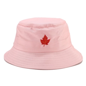 Detail of red maple leaf embroidery on pink cotton bucket hat with stitched brim