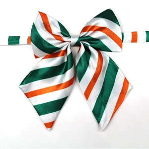 Detailed view of a green and orange striped satin pet bowtie with a smooth finish