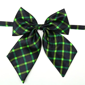 Classic dark green plaid dog bowtie in JK style with adjustable neck strap for small pets