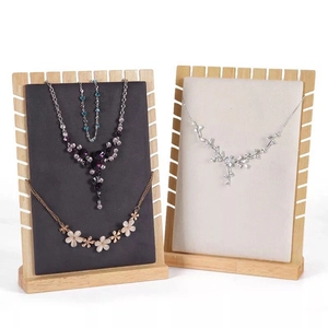 Bamboo and fabric necklace display stands with black and beige panels for jewelry display