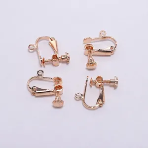 Close-up of four KC Gold plated screw-back ear clip converters for DIY jewelry making