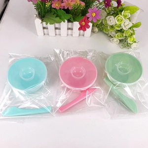 Three DIY face mask mixing tool sets with plastic bowls and spatulas in various colors