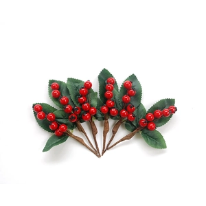Artificial red berry stems with green leaves for home decor, five pieces on white background
