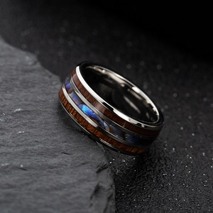 Men's titanium steel ring with wood inlay and abalone shell center on black stone