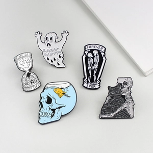 Detailed set of five gothic enamel pins featuring skull, hourglass, and ghost designs