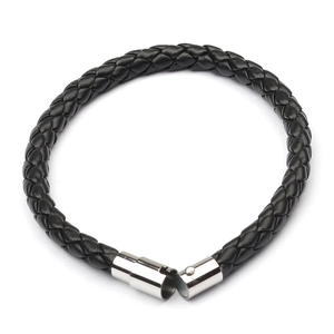 Detailed close-up of woven black leather strands and magnetic metal clasp on the bracelet