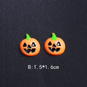 Detailed view of 1.5x1.6cm orange resin Halloween pumpkin charms for DIY crafts