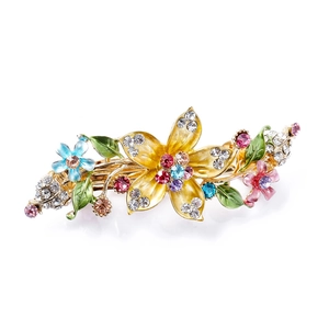 Elegant vintage floral hair clip with colorful crystals and enamel flower petals on gold metal