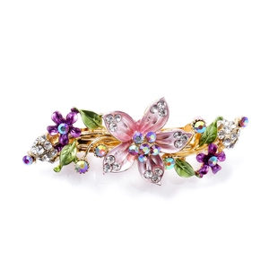 Vintage floral hair clip with pink enamel flowers and AB rhinestones on white backdrop