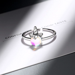 Minimalist S925 silver unicorn ring featuring a shimmering iridescent moonstone center
