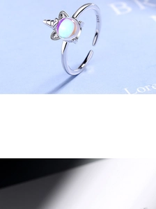 Macro shot of S925 sterling silver unicorn ring with colorful moonstone detail