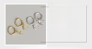 Detail showing S925 sterling silver crescent moon hoop earrings in gold and silver