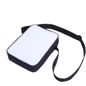 Side view of small rectangular crossbody bag with adjustable black strap and dual-tone finish