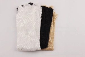 Detailed close-up of lace sun protection arm sleeves in white, black and beige colors