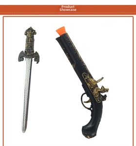 Detail of vintage pirate toy set including embossed flintlock pistol and cutlass sword