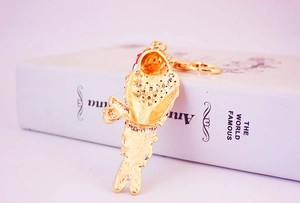 Detailed view of colorful parrot keychain with crystals on a golden metal chain
