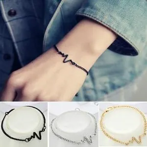 Detailed close-up showing adjustable heartbeat bracelets in black, gold, and silver finishes