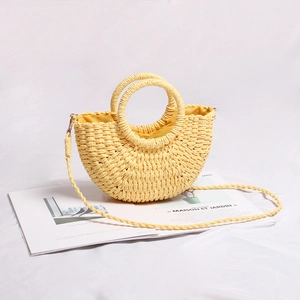Mini light yellow straw crossbody bag with circular handles for summer beach vacations