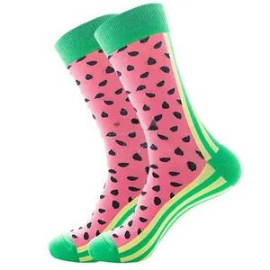 Detailed close-up of watermelon pattern knit socks with pink body and green trim