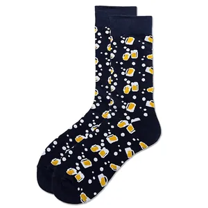 Detail of dark blue crew socks with yellow beer mug patterns and elastic cuffs