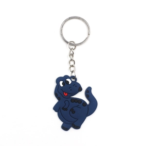 Close-up of a blue cartoon dinosaur keychain made of soft PVC and durable metal ring