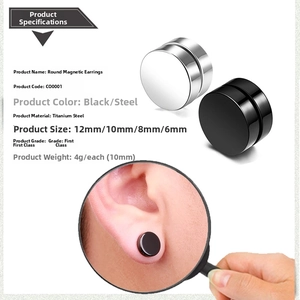 Macro detail of black and silver magnetic titanium steel stud earrings in various sizes