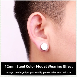 Macro shot of 12mm steel magnetic ear clip on earlobe showing punk jewelry style