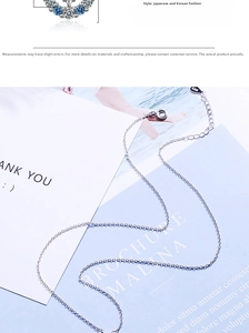 Close-up of S925 sterling silver star moon necklace with blue and white zircon pendant