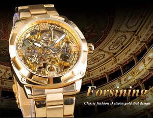 Macro shot of gold automatic mechanical watch with skeleton dial showing gear mechanism