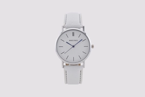 Detail of silver watch case with white dial, blue hands, and white leather strap