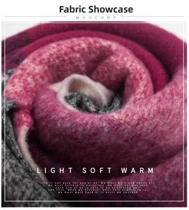 Close-up of thick pink and grey plaid knit scarf showing soft fuzzy fabric texture
