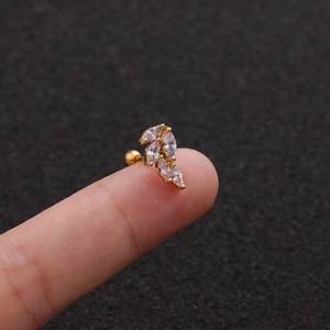Macro detail of leaf-shaped gold stud earring with five marquise-cut cubic zirconia stones