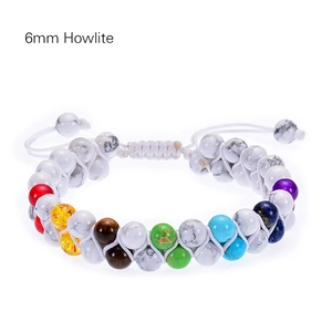Detailed macro view of 6mm white howlite beads and colorful chakra stones on woven bracelet