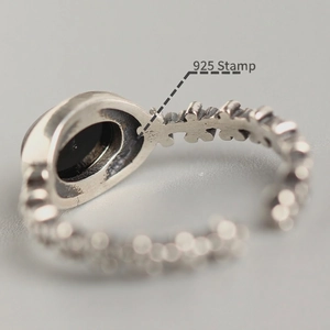 Vintage S925 sterling silver open ring with oval black onyx and petal textured band