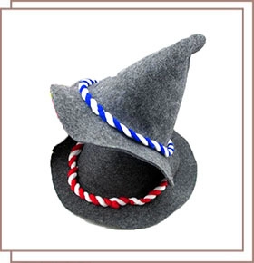 Detail of stacked grey felt Bavarian hats with red and blue twisted rope accents
