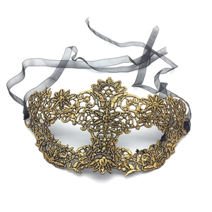 Detailed view of the gold lace embroidery mask with black organza ties for masquerade