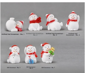 Set of 7 miniature resin Christmas snowmen in various poses with hats and gift boxes