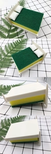 Detailed views of a creative white bed-shaped sponge holder on a tiled kitchen counter