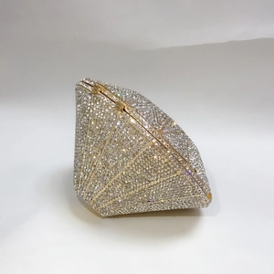 Detailed view of diamond-shaped clutch with full crystal pavé and golden metal frame