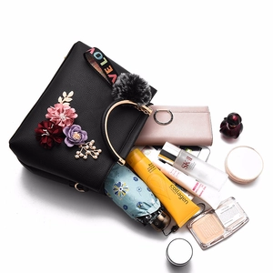 Fashionable black PU leather handbag with 3D floral accents and LOVE wide shoulder strap